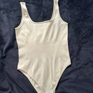 Elegant Cream Ribbed Bodysuit